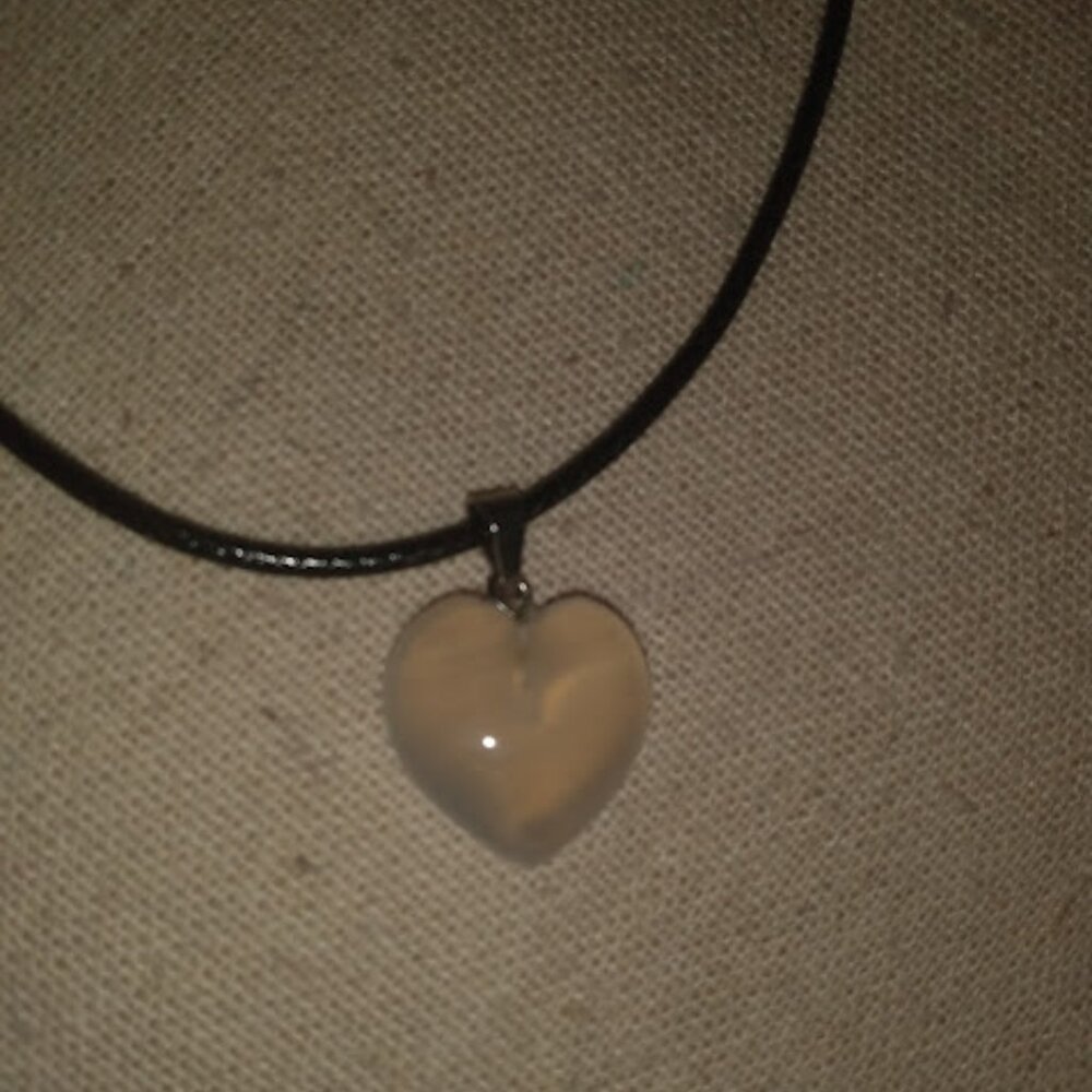 White translucent heart shaped stone pendant necklace.